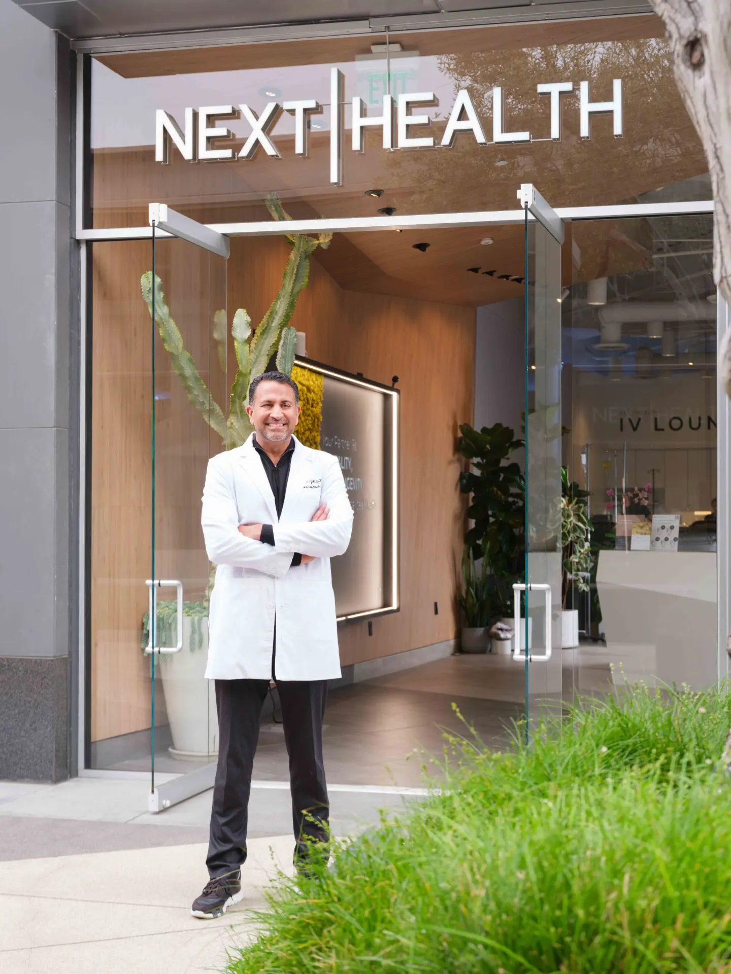 Next Health founders standing outside a Next Health clinic