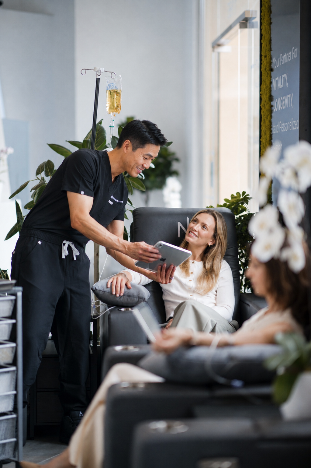 Next Health nurse reviewing results with a member during IV therapy