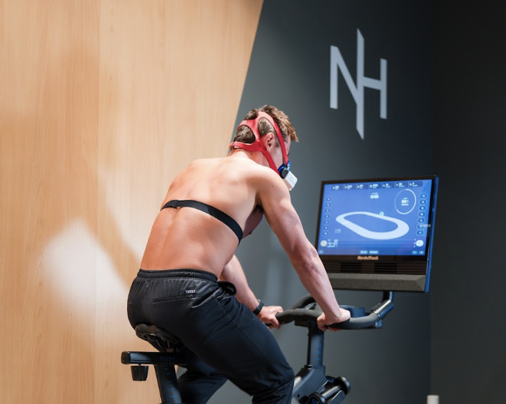 Client performing a VO2 max test on a stationary bike