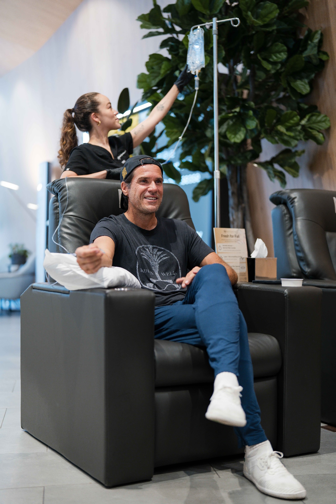 The Next Health IV Lounge — premium massage chairs, warm lighting, calm ambiance